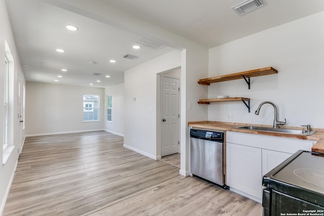 kitchen with white cabinets, sink, dishwasher, black range with electric stovetop, and butcher block counters