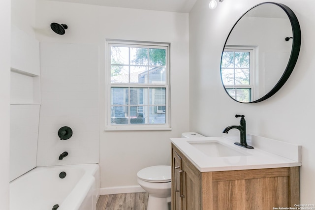 full bathroom with vanity, a healthy amount of sunlight, toilet, and shower / bath combination