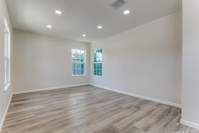 spare room featuring light wood-type flooring