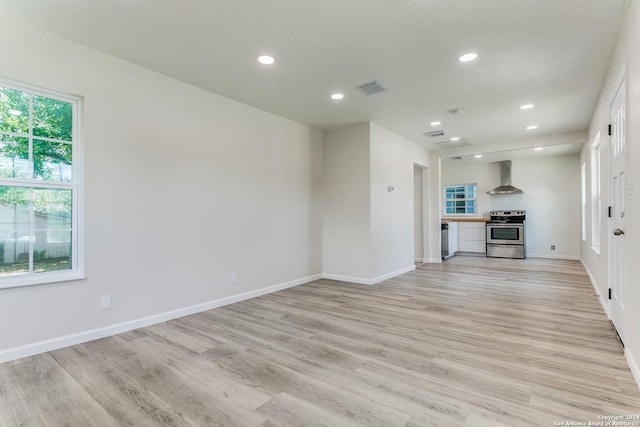 unfurnished living room with light hardwood / wood-style flooring