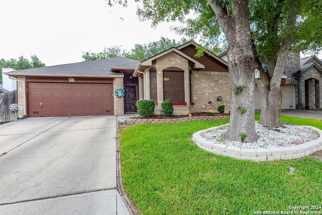 single story home with a front lawn and a garage