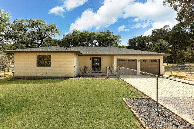 ranch-style house with a front lawn and a garage