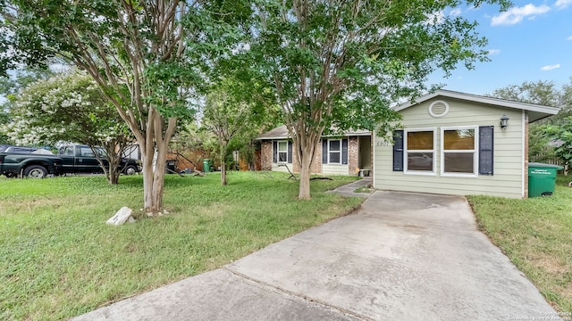 ranch-style house with a front lawn