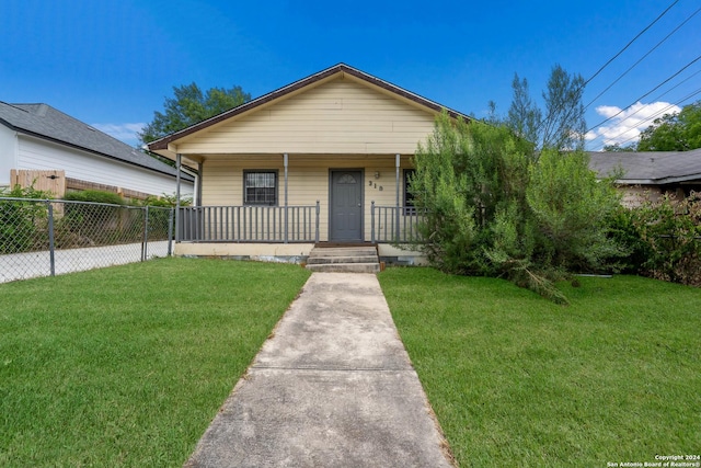 bungalow-style house with a porch and a front yard