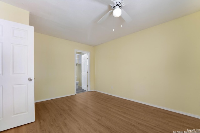 spare room featuring ceiling fan and wood-type flooring