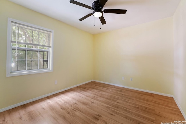 spare room featuring ceiling fan and light hardwood / wood-style floors