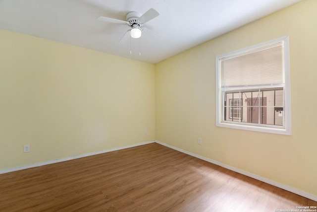 unfurnished room featuring ceiling fan and wood-type flooring