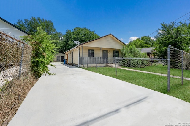 ranch-style house with a porch and a front yard