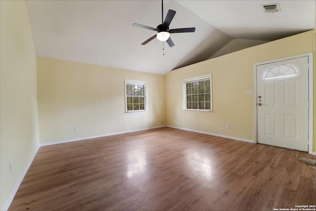 foyer with hardwood / wood-style floors, vaulted ceiling, and ceiling fan