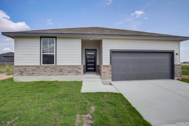 single story home featuring a front yard and a garage