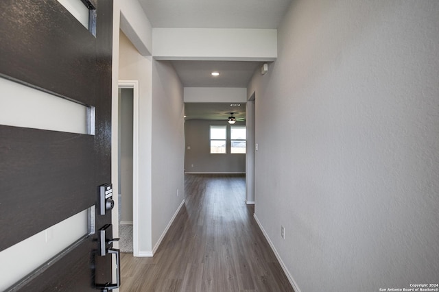 corridor featuring wood-type flooring