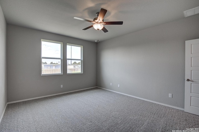 unfurnished room featuring carpet and ceiling fan