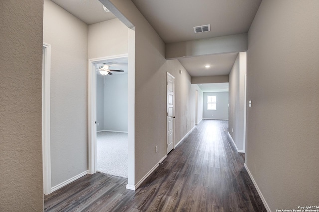 corridor featuring dark hardwood / wood-style floors