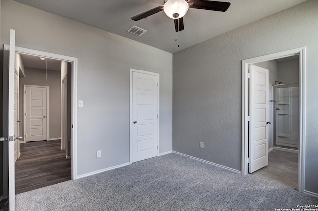 unfurnished bedroom featuring ceiling fan, connected bathroom, and dark colored carpet