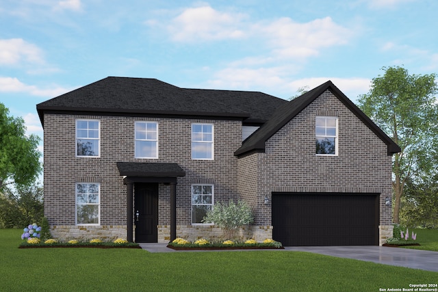 view of front of home featuring a front yard and a garage