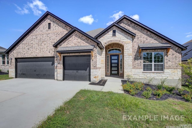 french country home with a garage