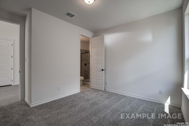 unfurnished bedroom with carpet flooring