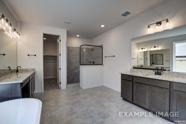 bathroom featuring vanity and plus walk in shower