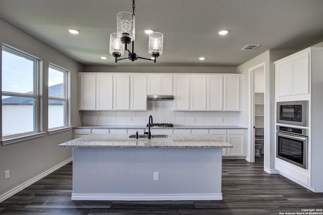 kitchen with sink, white cabinetry, dark hardwood / wood-style floors, and oven