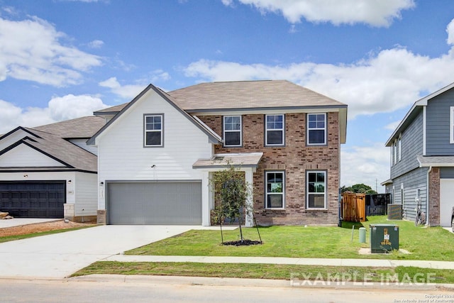 view of front of house featuring a garage and a front lawn