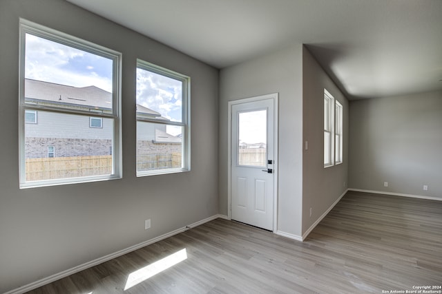 foyer entrance with light hardwood / wood-style flooring