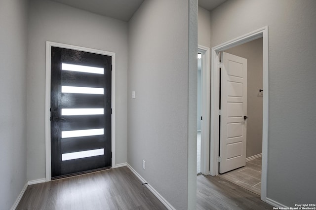 foyer entrance with light wood-type flooring