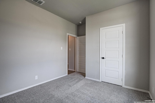 unfurnished bedroom featuring carpet