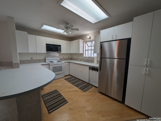 kitchen with ceiling fan, white cabinetry, white appliances, and light hardwood / wood-style floors