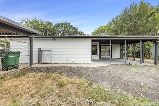 back of house featuring french doors