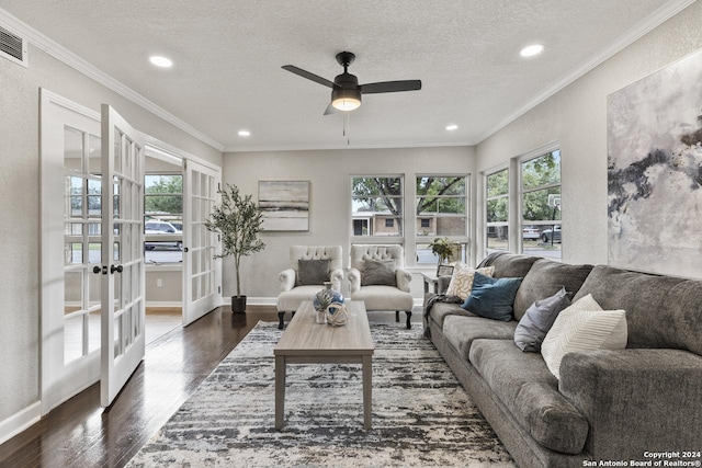 living room featuring a textured ceiling, ceiling fan, french doors, and dark hardwood / wood-style floors