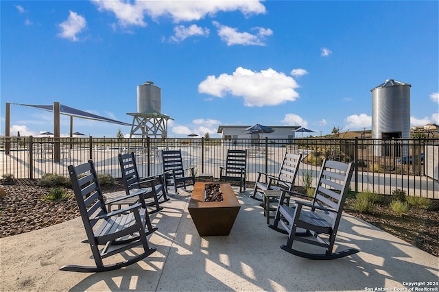 view of patio / terrace with a fire pit