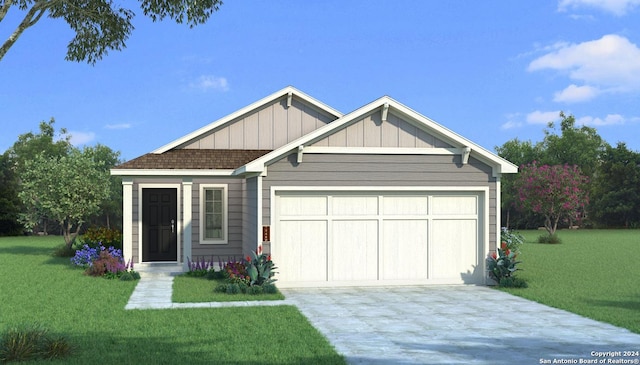 view of front of property featuring a front yard and a garage