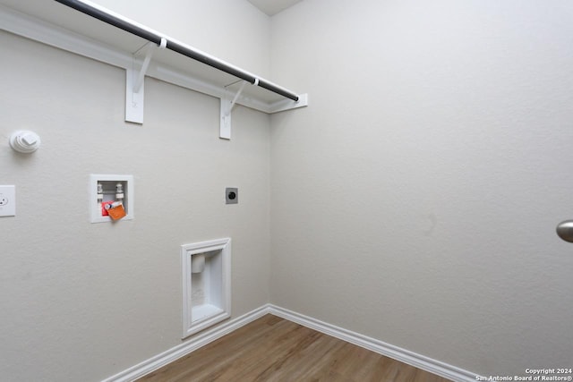 laundry room with electric dryer hookup, washer hookup, and hardwood / wood-style flooring