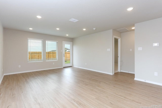 unfurnished room with light hardwood / wood-style floors