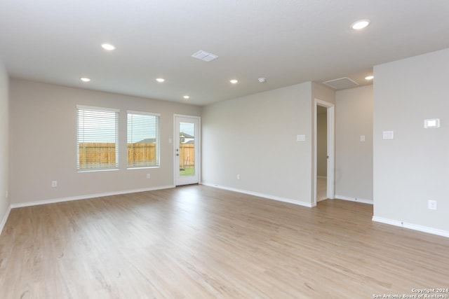 unfurnished room with light hardwood / wood-style flooring