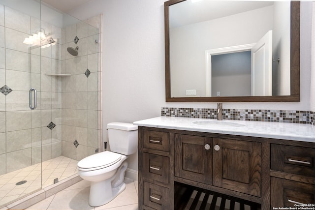 bathroom with toilet, walk in shower, decorative backsplash, tile patterned flooring, and vanity