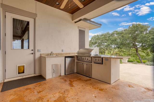 view of patio / terrace with area for grilling and ceiling fan