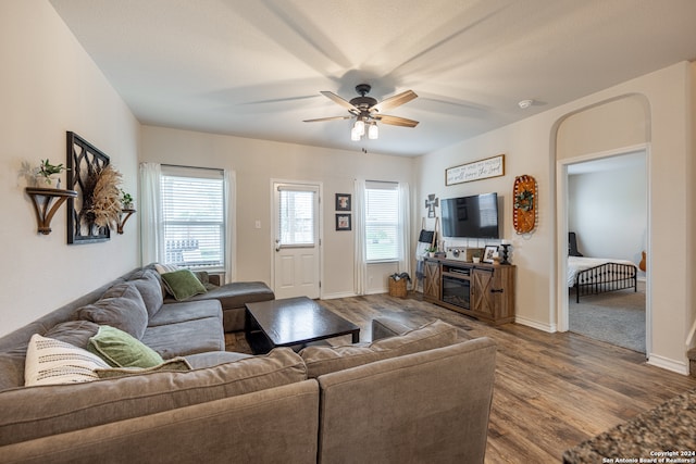 living room featuring ceiling fan and hardwood / wood-style floors