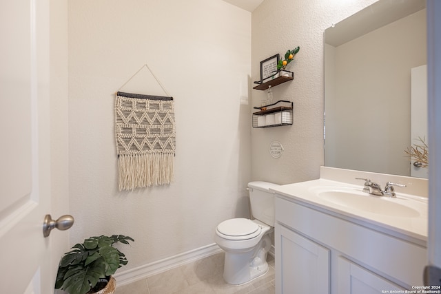 bathroom featuring tile flooring, oversized vanity, and toilet