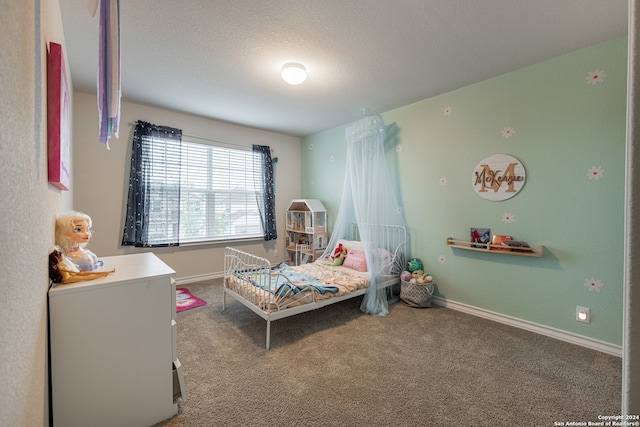 carpeted bedroom with a textured ceiling