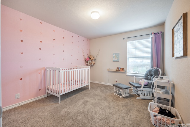 carpeted bedroom featuring a crib