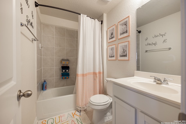 full bathroom featuring tile flooring, shower / tub combo, a textured ceiling, toilet, and large vanity