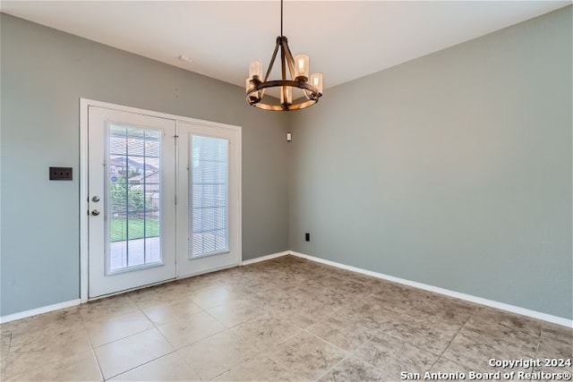 entryway with an inviting chandelier