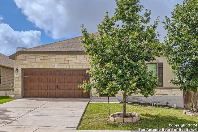 view of front of home with a garage