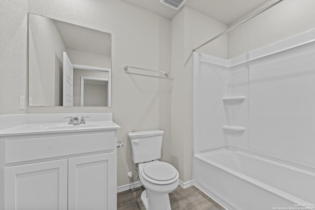 full bathroom with shower / bathing tub combination, vanity, toilet, and hardwood / wood-style flooring