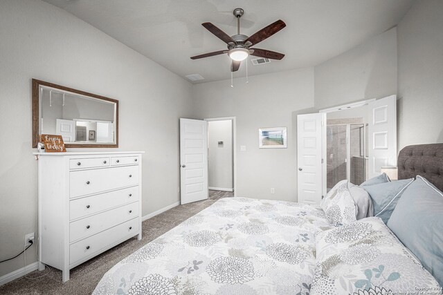 carpeted bedroom featuring ensuite bath and ceiling fan