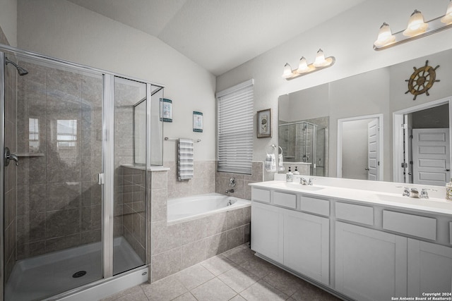 bathroom with tile patterned flooring, vanity, plus walk in shower, and lofted ceiling