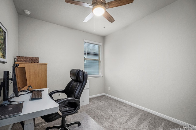 carpeted office featuring ceiling fan