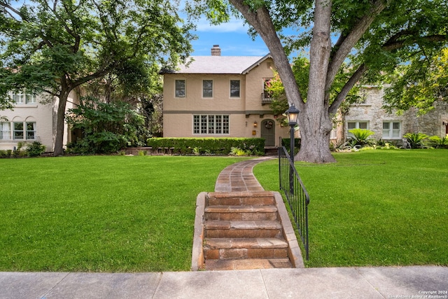 view of front of home with a front yard