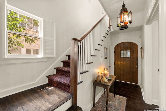 entryway featuring dark wood-type flooring